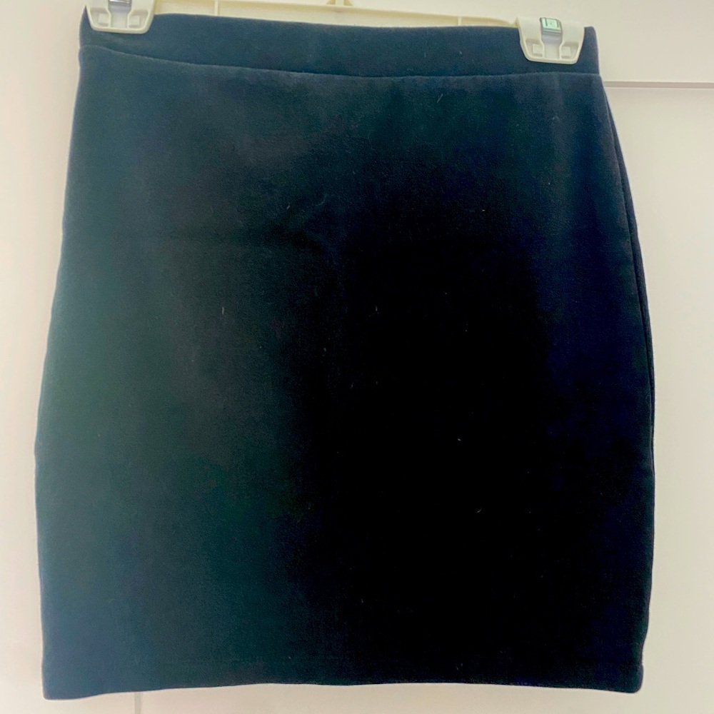 Monk mini skirt from Norway. Body con, hits mid thigh